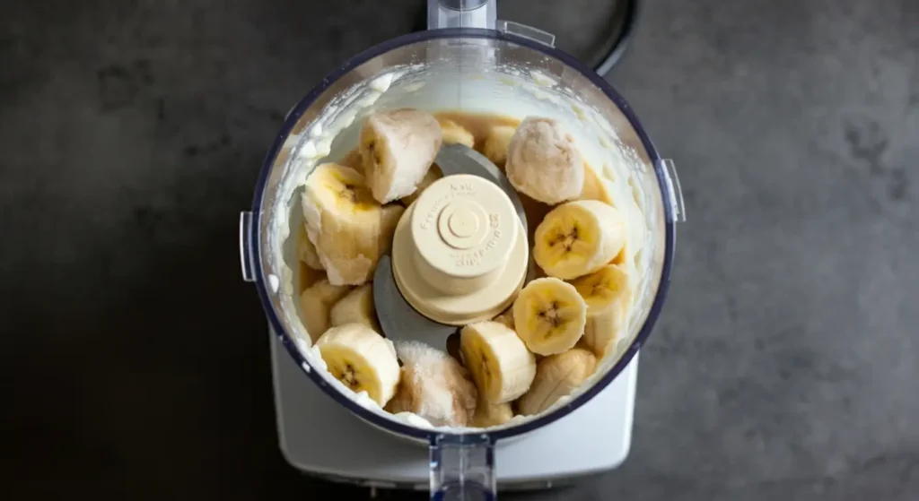 Blending banana and yogurt for frozen yogurt mixture