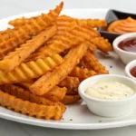 Sweet potato waffle fries with dipping sauces.